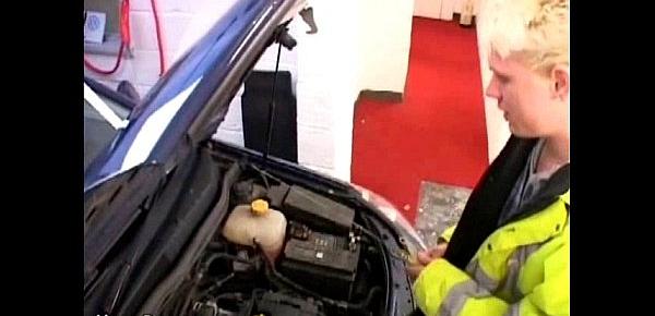  Young car mechanic servicing older gay businessman